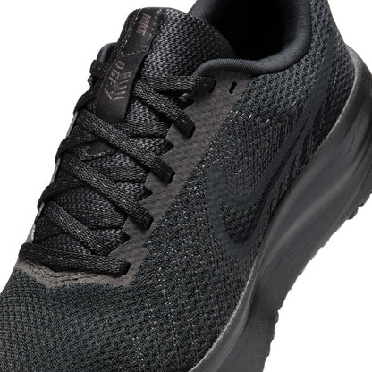 Close-up of black lace-up knit upper with embossed logo near the tongue