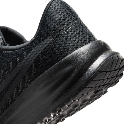 Side close-up of black running shoe with textured knit and durable rubber sole