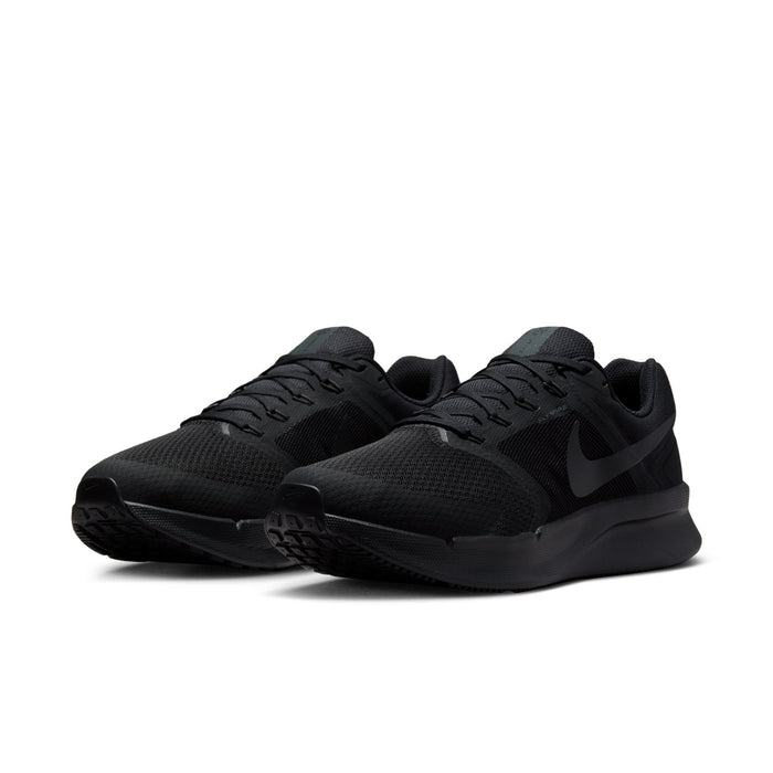 Black men’s running shoe with knit mesh upper, lace-up closure, and swoosh detail