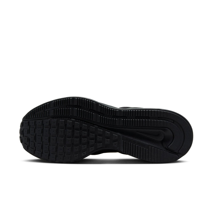 Black rubber outsole with raised tread pattern for traction