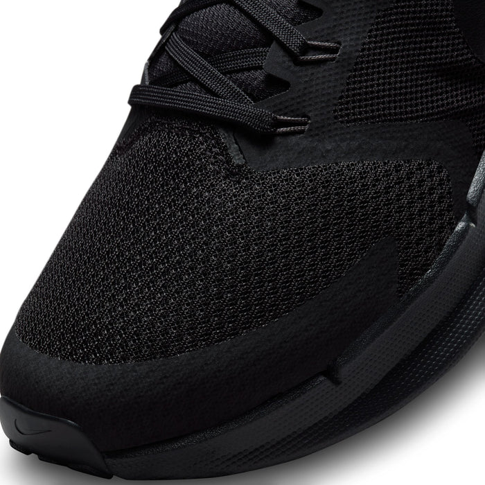 Black men’s running shoe upper close-up with laces and textured knit vamp