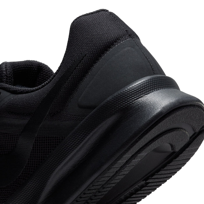 Black mesh running shoe close-up with molded side panel and thick tread sole