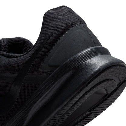 Black mesh running shoe close-up with molded side panel and thick tread sole