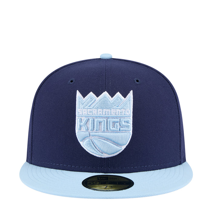 Two-tone baseball cap, light navy crown with light brim and embroidered front logo