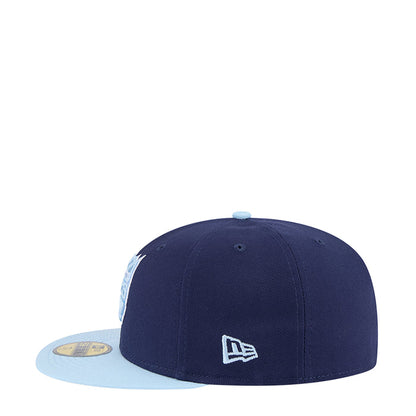 Two-tone baseball cap, navy crown with light brim and small embroidered side logo