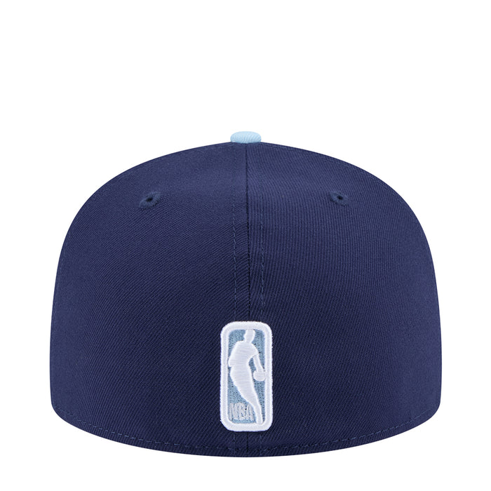 Two-tone baseball cap, dark navy crown with light brim and embroidered back logo