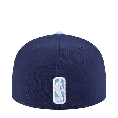 Two-tone baseball cap, dark navy crown with light brim and embroidered back logo
