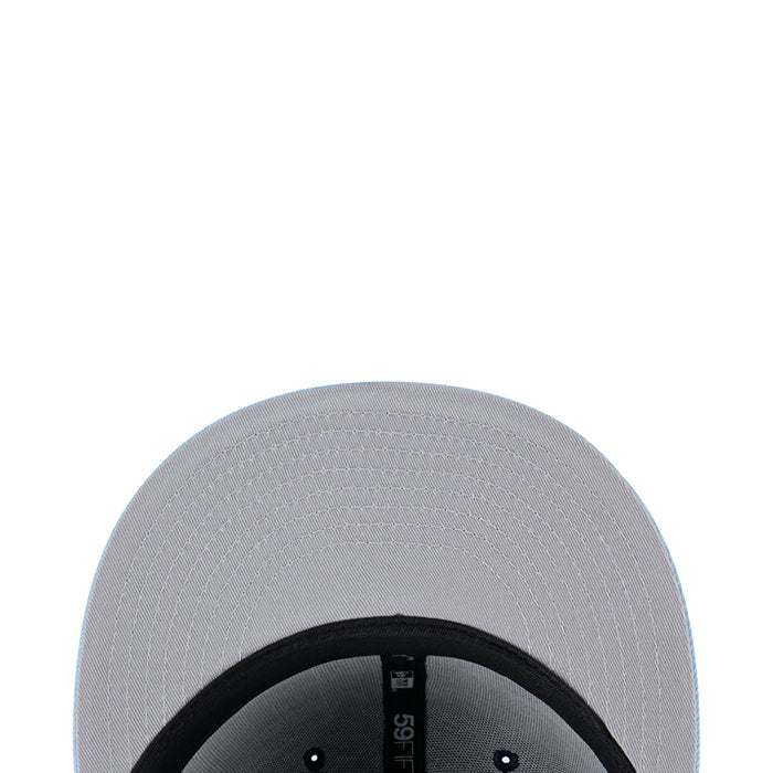 Two-tone baseball cap panel close-up with light silver fabric and black underside