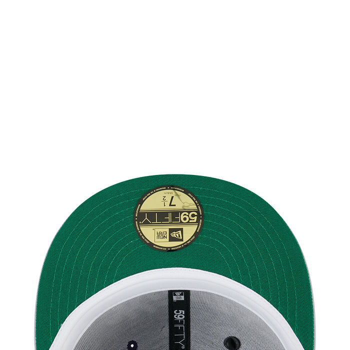 Green satin cap detail, circular label on crown with gray/black panel