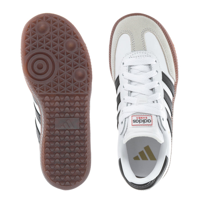 Kids sneakers: one view of brown tread outsole and one white upper with black stripes