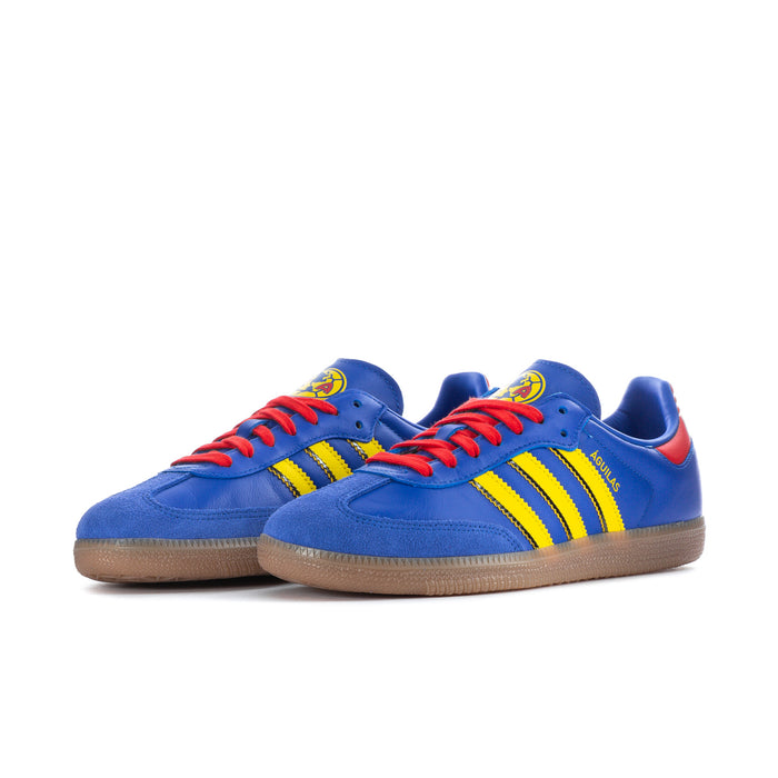 Men's blue low-top sneakers side by side, red laces, yellow stripes, gum sole