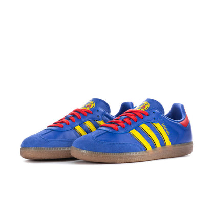 Men's blue low-top sneakers side by side, red laces, yellow stripes, gum sole