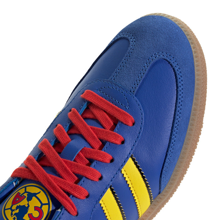 Men's blue suede-style sneakers with red laces and yellow stripe logo detail