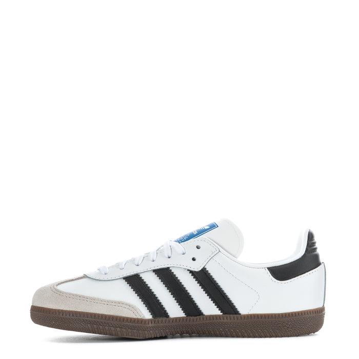 Kids' white sneakers with black adidas-style stripes, lace-up front, gum outsole