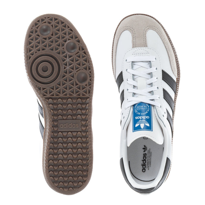 Kids' sneakers shown from sole and top, with adidas branding and blue tongue label