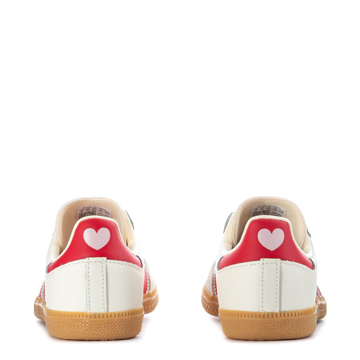 Kids cream sneakers with red heel lining and heart detail, gum outsole