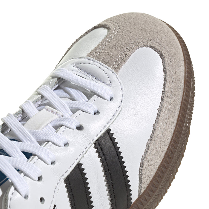 Kids' white sneaker toe with lace-up, suede trim, and black side stripes