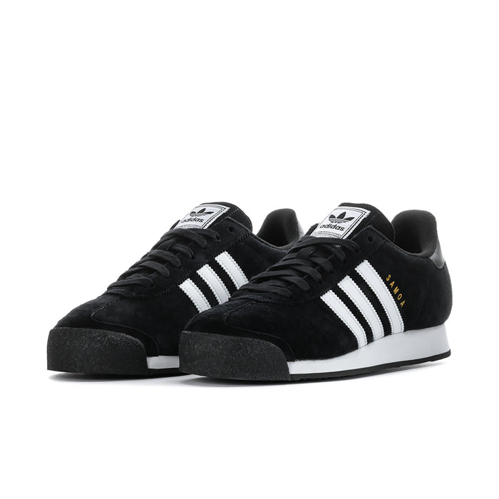 Pair of black suede low sneakers with white three stripes and thick black sole