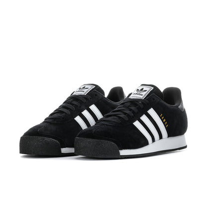 Pair of black suede low sneakers with white three stripes and thick black sole