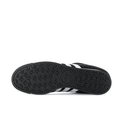 Black textured rubber outsole with adidas logo on underside of sneaker