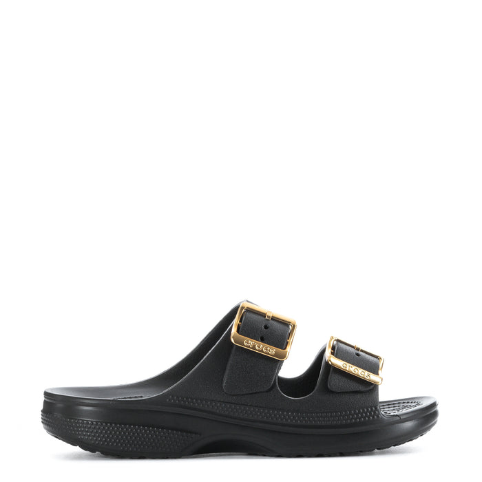 Women's black slide sandal with gold buckle straps and textured footbed