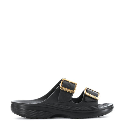 Women's black slide sandal with gold buckle straps and textured footbed