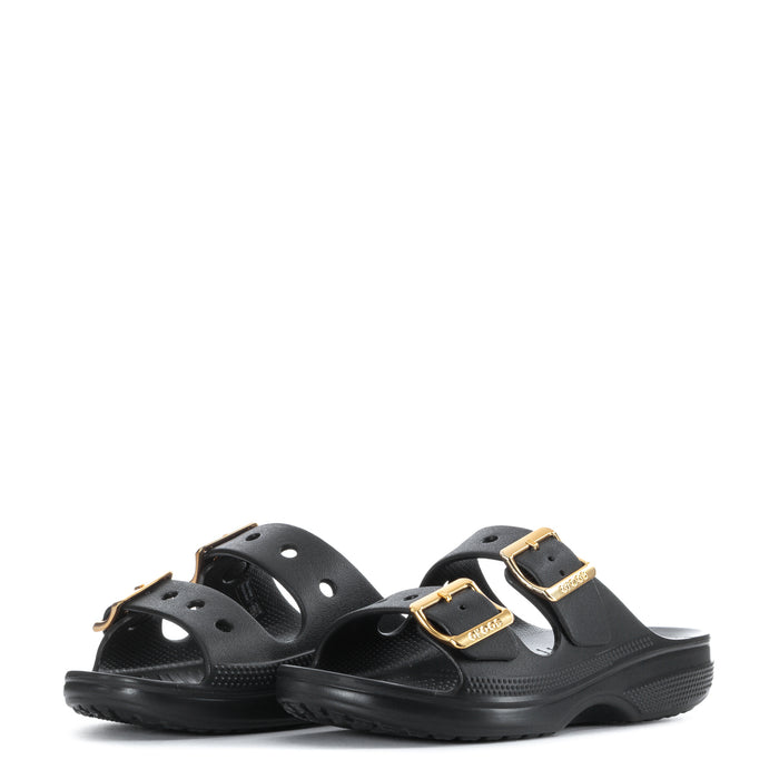 Women's black sandal with two gold metal buckle straps and perforated foot opening