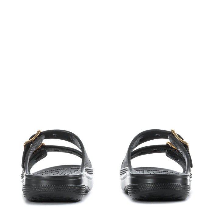 Women's black slide sandal with gold buckle straps at heel