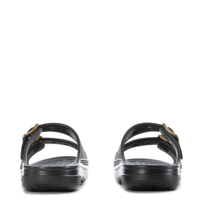 Women's black slide sandal with gold buckle straps at heel