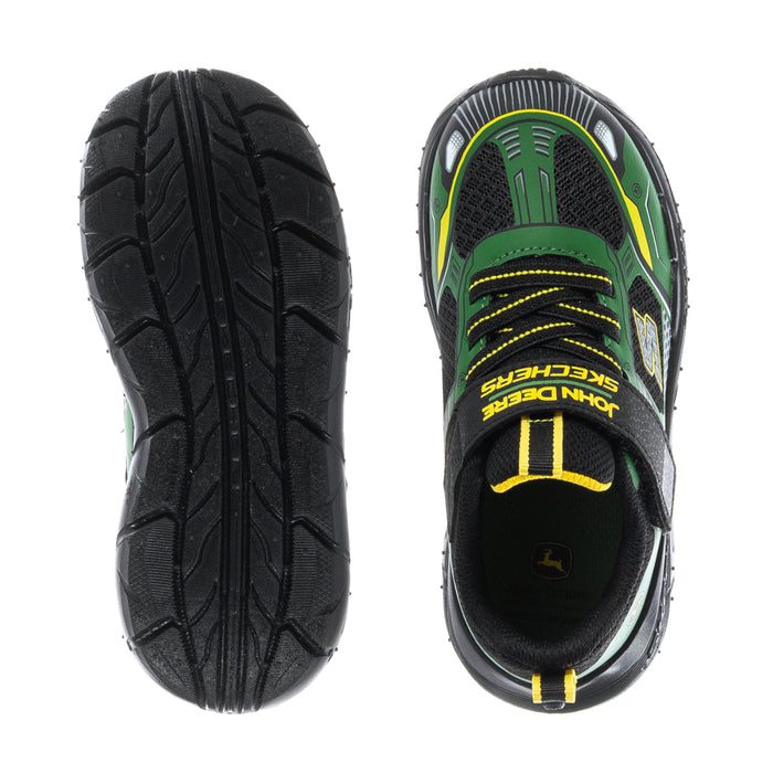 Toddler sneaker outsole view with black tread, green lining, lace-up front.