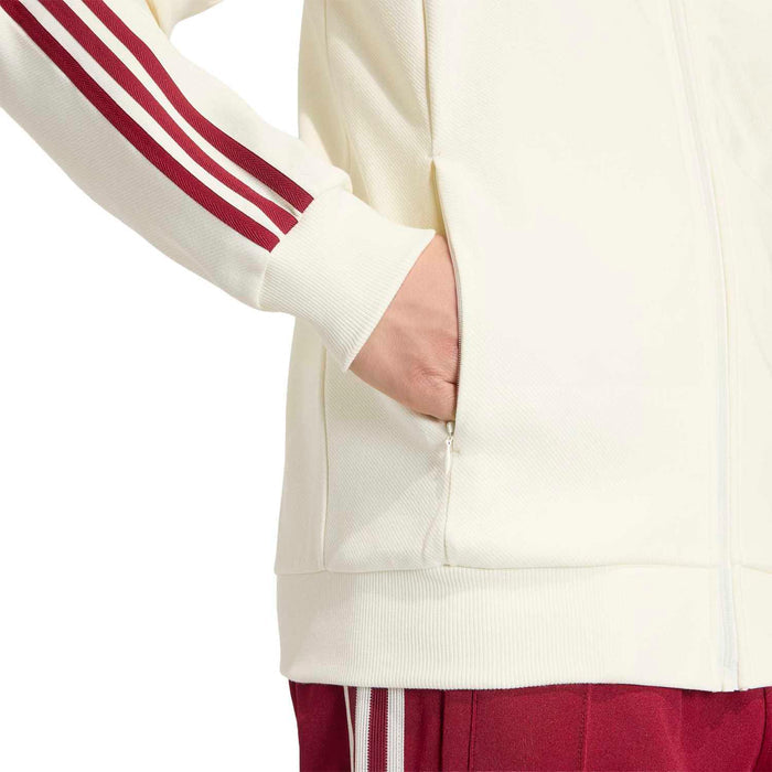 Men's off-white zip-up jacket with burgundy sleeve stripes and zippered front pocket