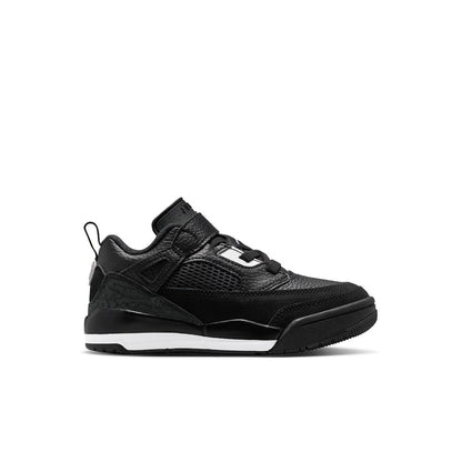 Kids black low-top sneakers with white logo accents, hook-and-loop strap, lace-up