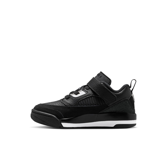 Kids black low-top sneakers with mesh panels, white logo accents, lace-up