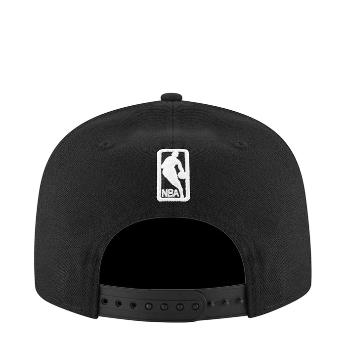 Black snapback cap with NBA logo patch on back