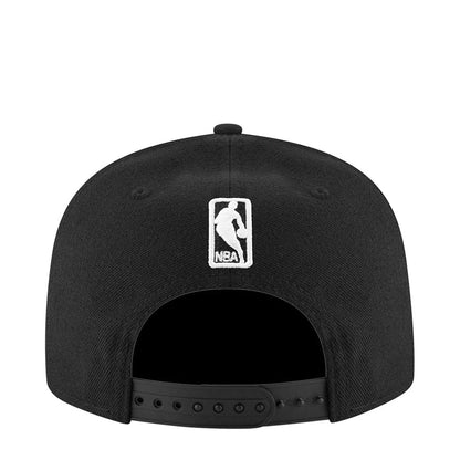 Black snapback cap with NBA logo patch on back