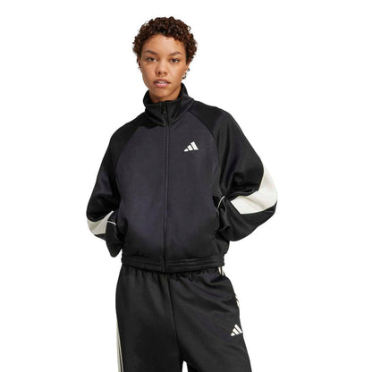 Black womens stadium tracktop with off-white sleeve panels and center zipper closure.