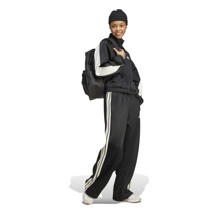 Black womens stadium tracktop with off-white sleeve stripes and high collar.