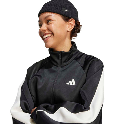 Black adidas tracktop with off-white sleeve panels, high collar, and chest logo.