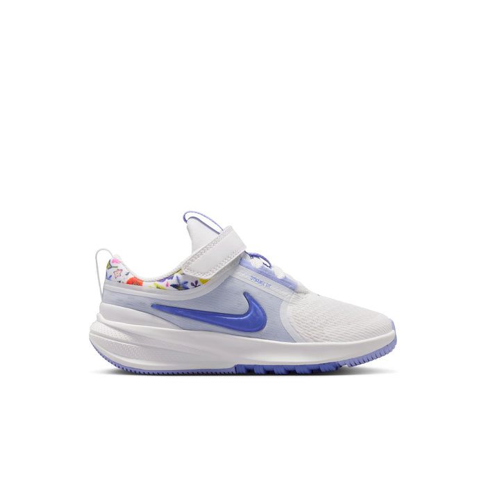 Kids white and blue low-top running shoe with Velcro strap and swoosh logo
