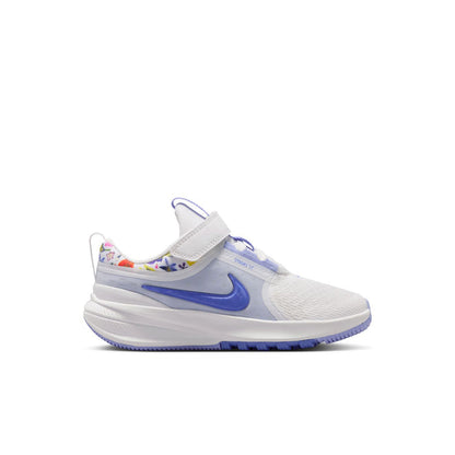Kids white and blue low-top running shoe with Velcro strap and swoosh logo