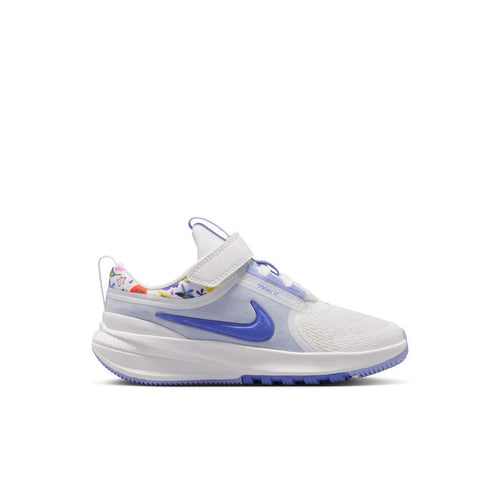 Kids white and blue low-top running shoe with Velcro strap and swoosh logo