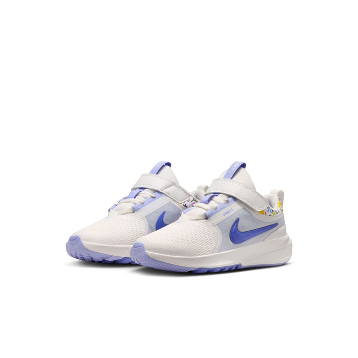 Kids white and blue low-top running shoes, side view with blue swoosh and lace panel