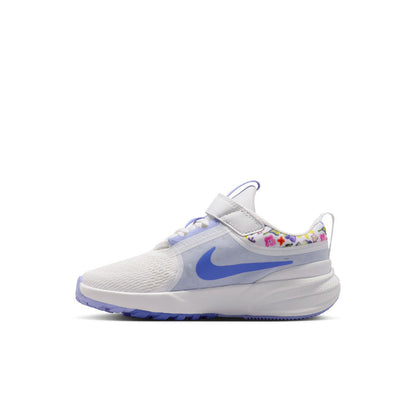 Kids white and blue low-top running shoe with Velcro strap and patterned collar