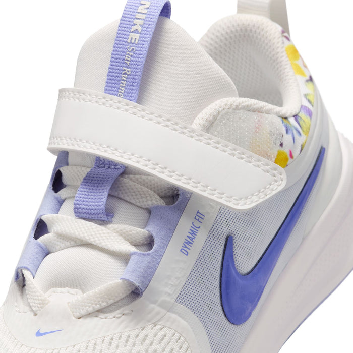 Kids white running shoe upper close-up with blue swoosh and lace detail