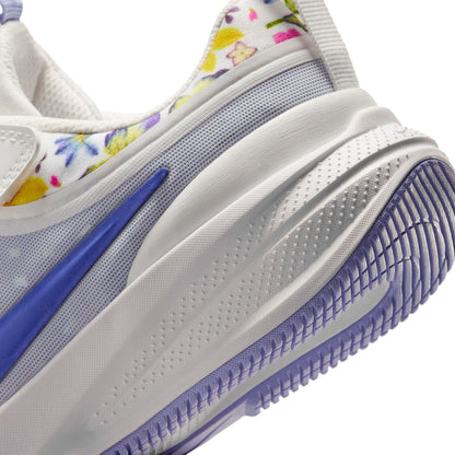 Kids white and blue sneaker midsole and outsole close-up with patterned tread