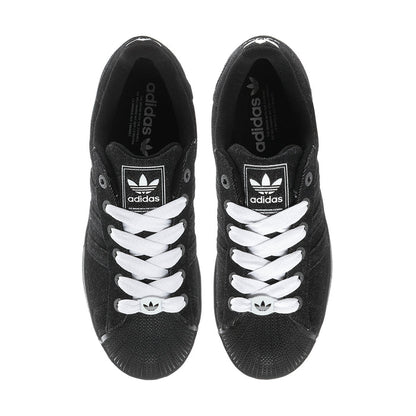 Black adidas sneakers with white laces and tongue logo, front view of both shoes
