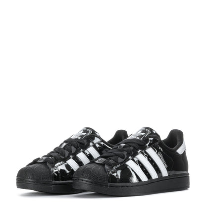 Youth low-top sneakers, black gloss with white stripes and textured toe cap