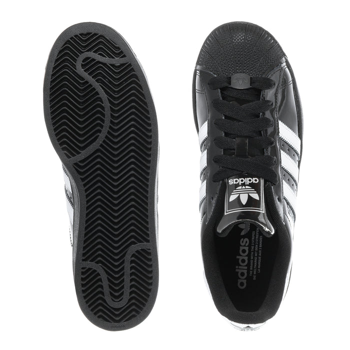Youth sneaker outsoles with patterned tread, seen from underside