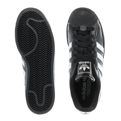 Youth sneaker outsoles with patterned tread, seen from underside
