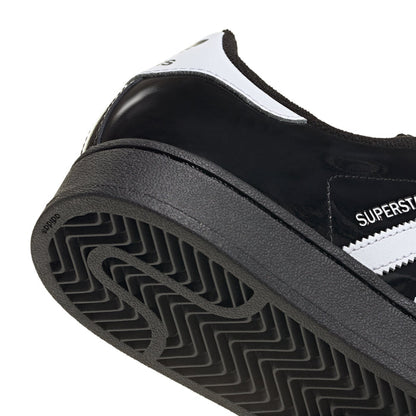 Youth sneakers outsole close-up with rubber tread pattern and heel area
